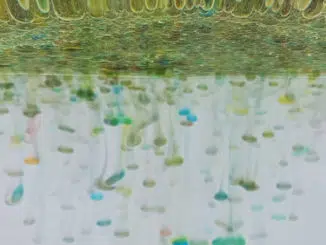 colorful rain in a glass of water